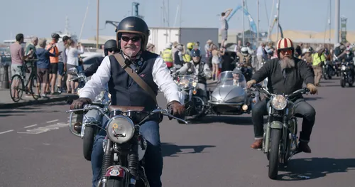 Distinguished Gentlemen's Ride riders on motorbikes along Poole Quay