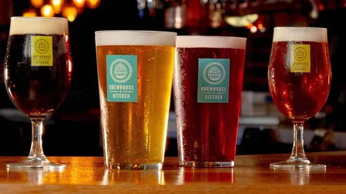 Four pints of beer on a bar