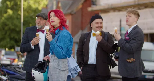 Distinguished Gentlemen's Ride members eating ice cream