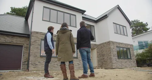 People being shown a new build home